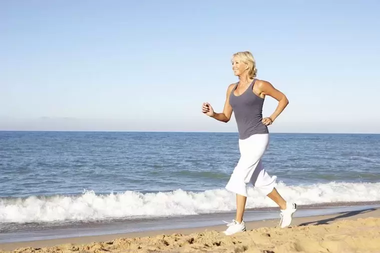 Elderly woman jogging for weight loss and good heart function